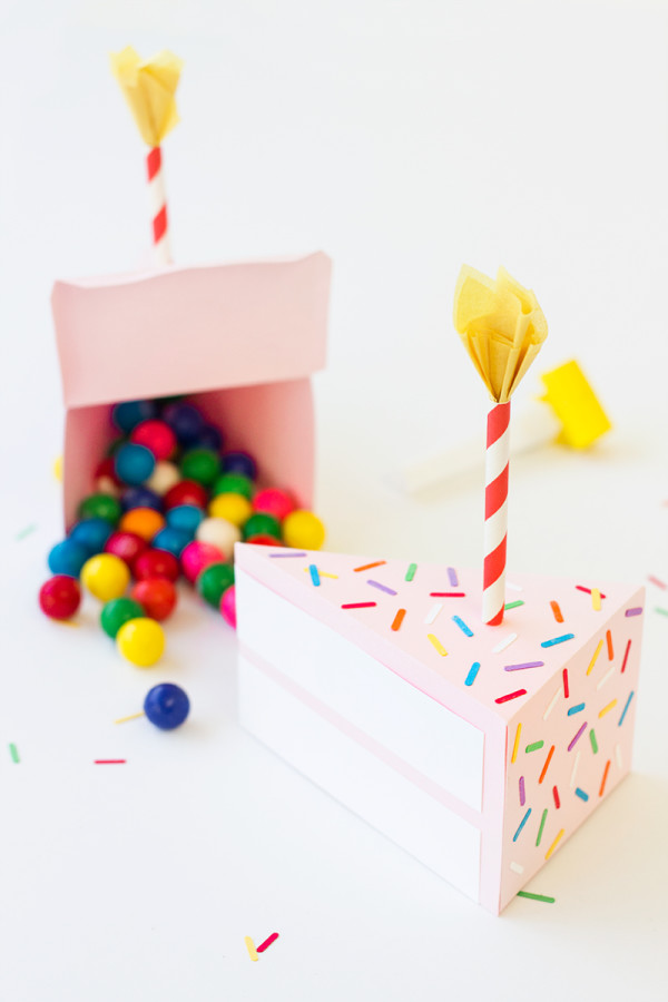 A paper birthday cake and gum balls