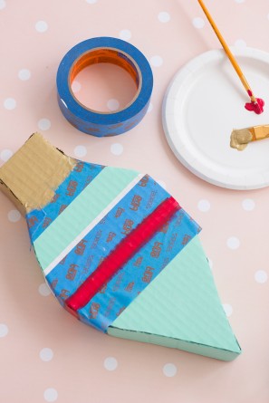 Colorful cardboard box and a plate with paint