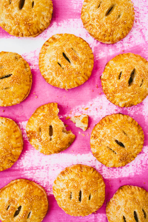 Mini pies on a pink surface