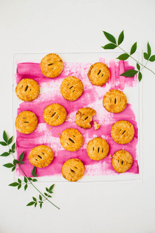 Mini pies on a pink surface