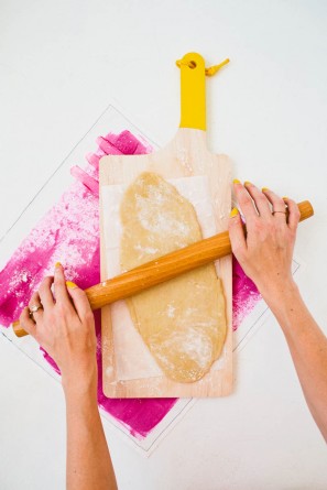 Someone rolling dough