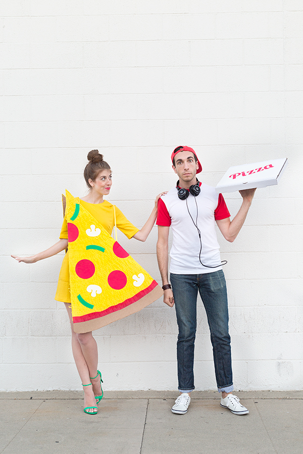 A woman dressed as pizza and a man dressed as a delivery man