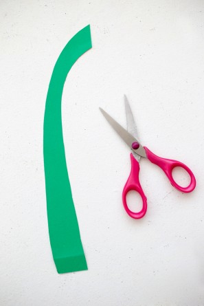 green paper stem with scissors next to it