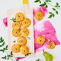 Let's Eat! | Vanilla-Cardamom Pear Hand Pies Mini pies on a cutting board