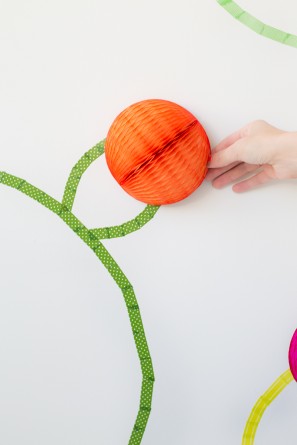 Orange paper ball and green tape 