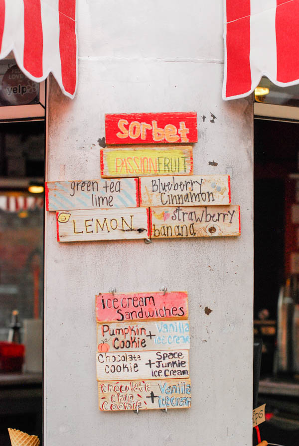 Wooden signs with ice cream flavors on it