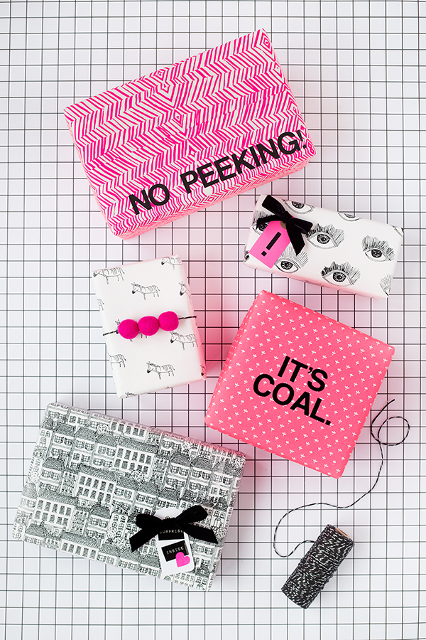 A pink box that says \"no peeking\" and other presents 