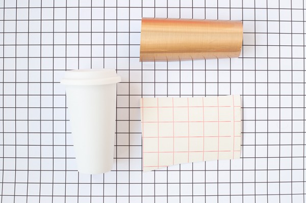 Paper mugs, gold paper, and pink paper