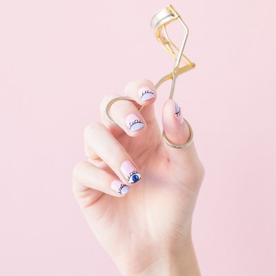 DIY "Wink Wink" Mani Tutorial Someone holding an eyelash curler