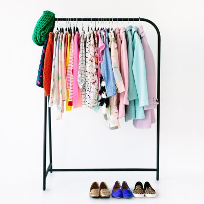 How To Add Color To Your Winter Wardrobe A colorful clothing rack