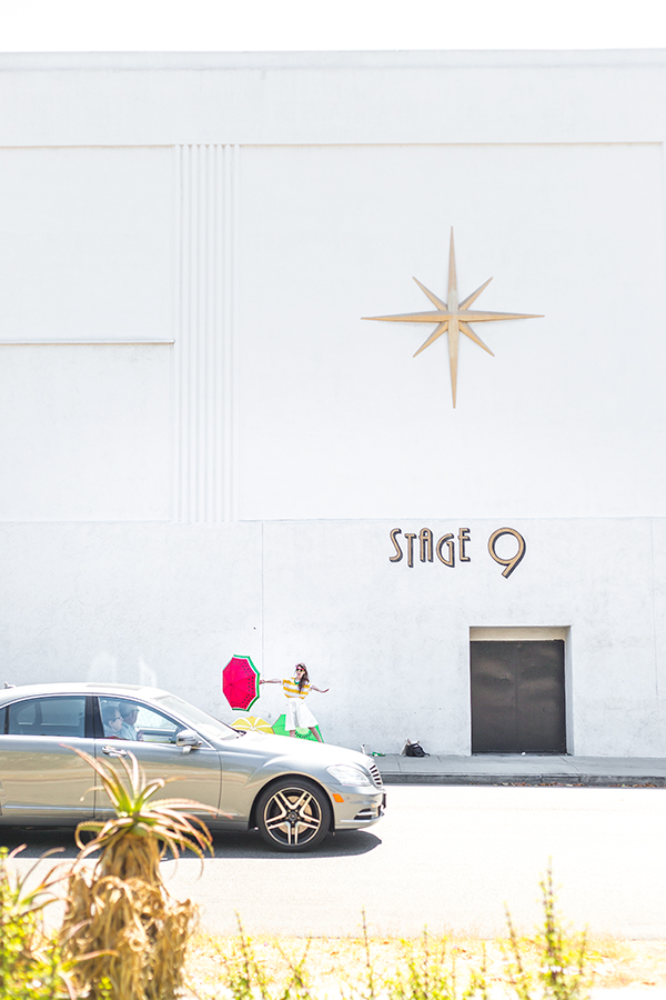 A car in front of a wall that says \"stage 9\"

