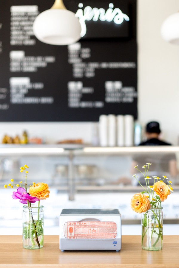 An ice cream store with flowers 