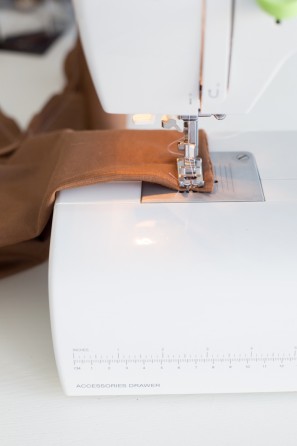 Brown fabric being sewn