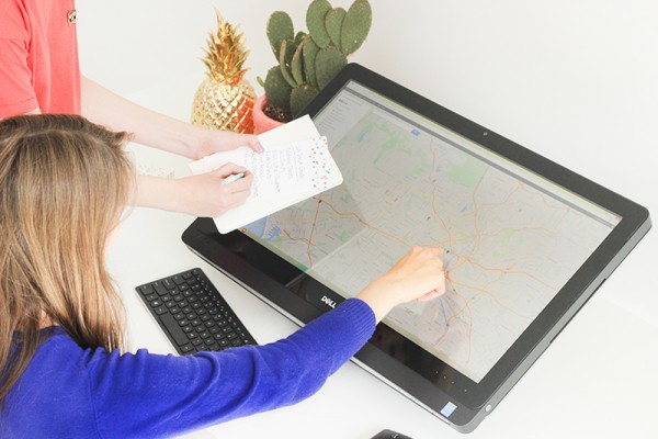 A woman touching a digital map