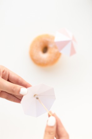A donut with a little umbrella