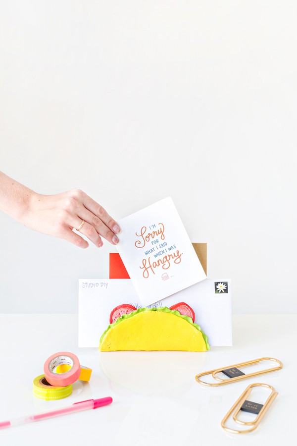 Someone putting a card in a taco holder