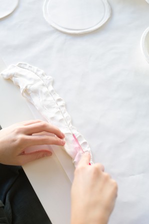 Someone molding clay