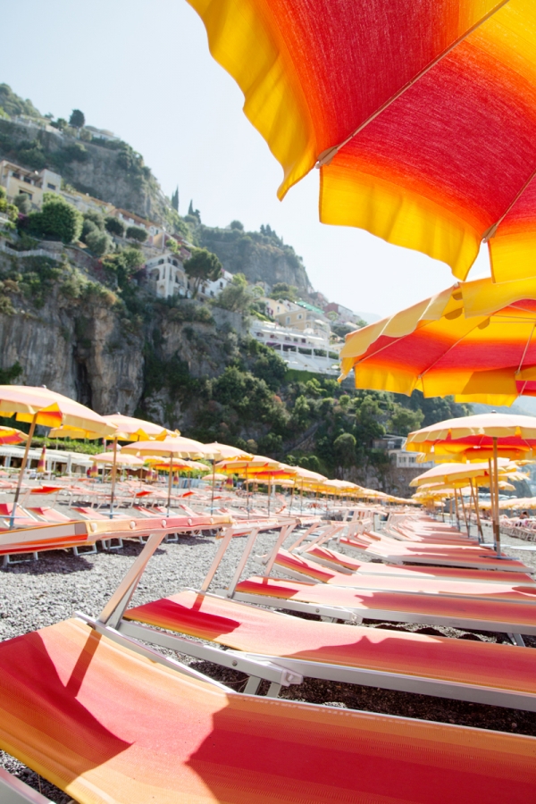 Orange chairs with umbrellas