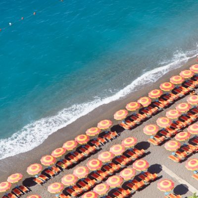 #MeetTheMindells: Our Honeymoon on the Amalfi Coast A beach with chairs and umbrellas