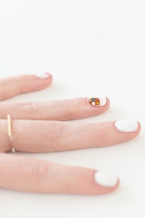 A close up of a hand with a ring