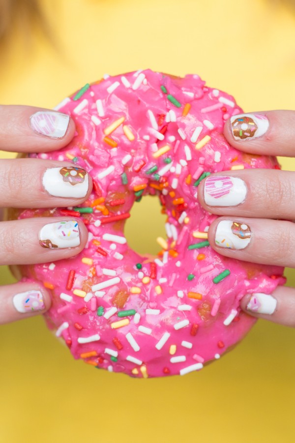 Someone holding a pink donut