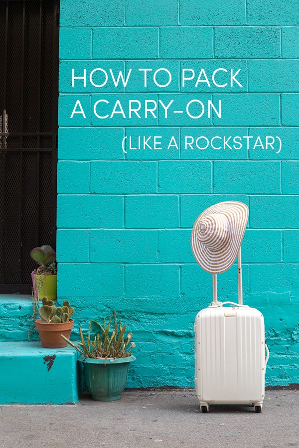 A blue wall and white suitcase 