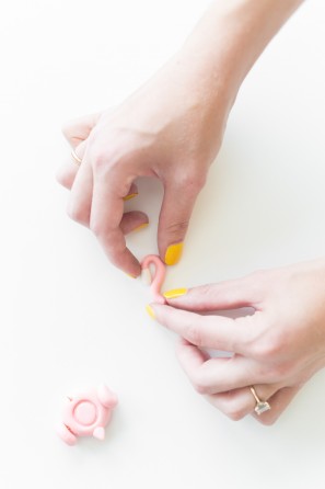Someone folding clay