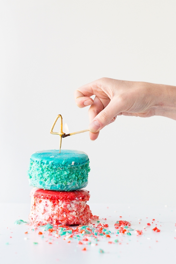 Someone lighting a \"4\" candle