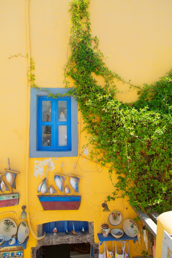 A yellow building with blue windows