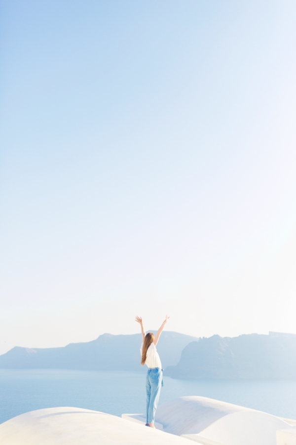 A woman holding her hands in the air