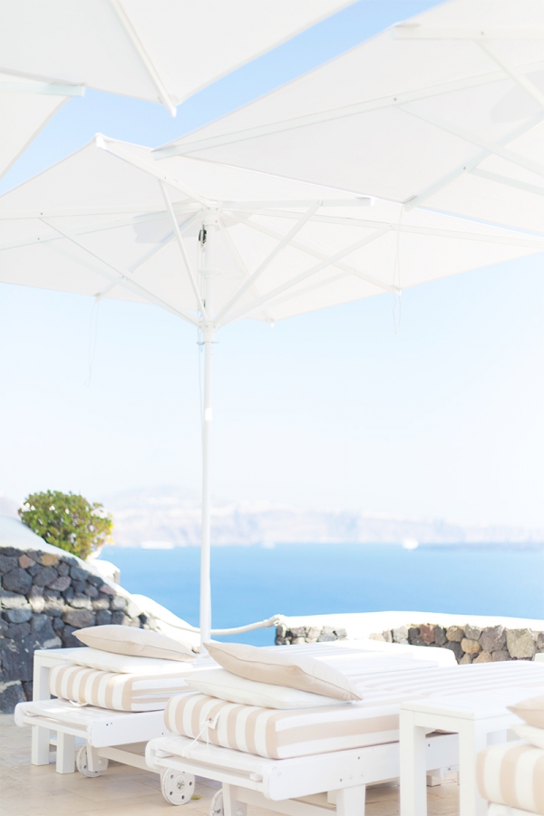 A white chair with umbrella