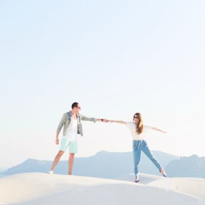 #MeetTheMindells: Our Honeymoon in Santorini Two people standing on a white surface