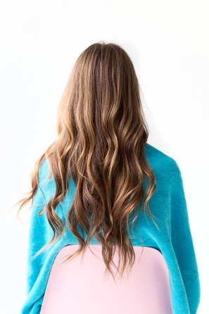 A woman with wavy brunette hair