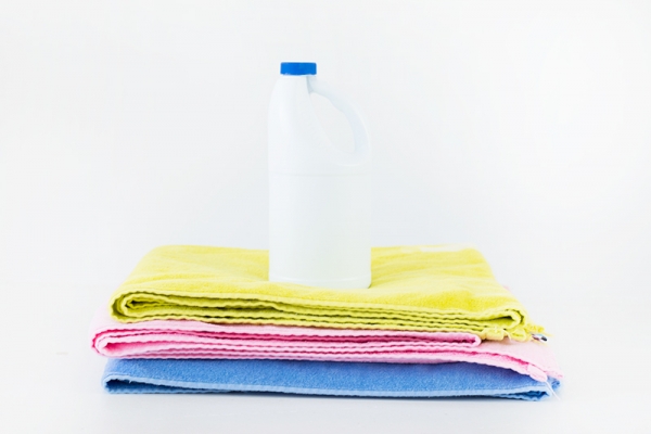 Towels and a bottle of bleach