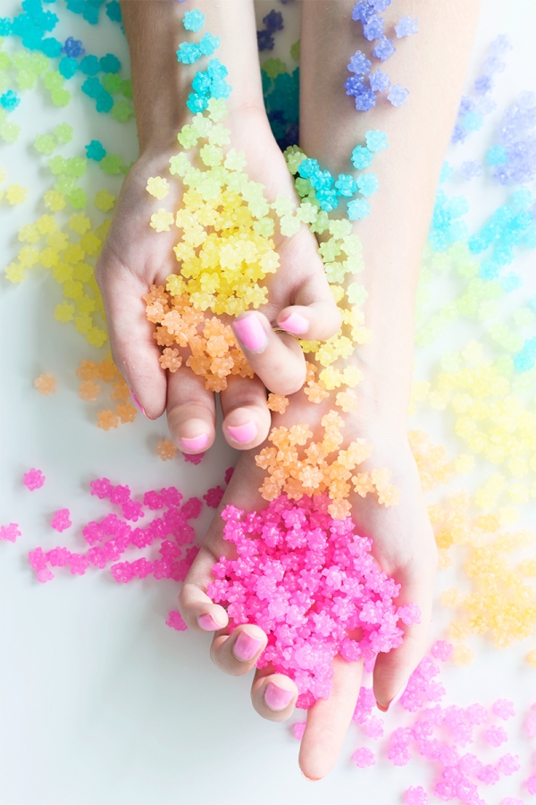 Someone holding rainbow candies