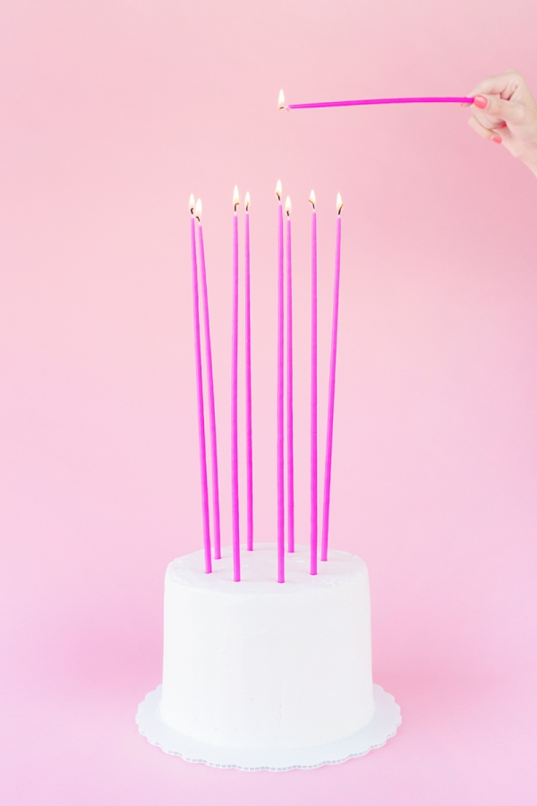Pink candles on a cake