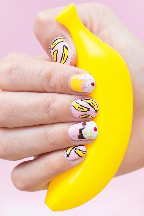Manicure Party Someone holding a fake banana with banana split nails