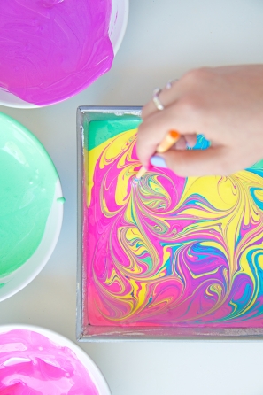 Someone mixing paint