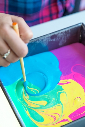 Someone mixing paint