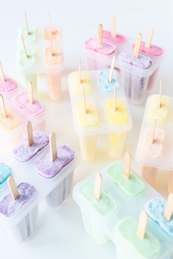 Someone making colorful popsicles