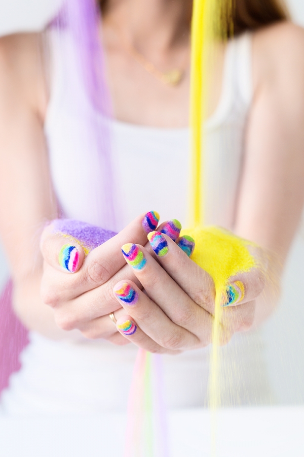 Someone holding rainbow powder