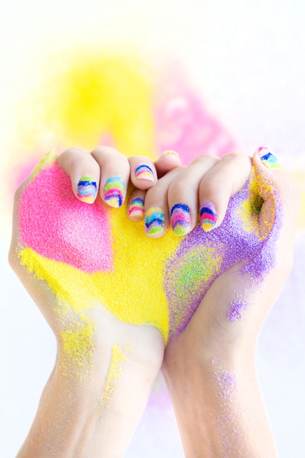 Someone holding rainbow powder