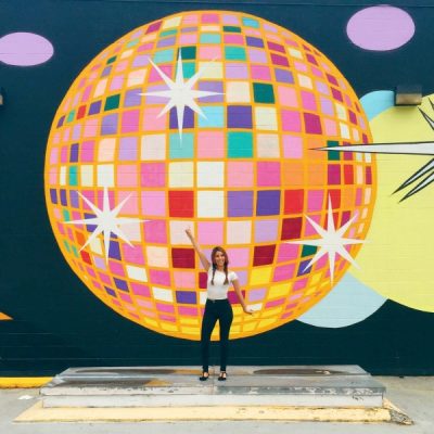 #StudioDIYWallCrawl: The Best Walls in Atlanta A woman standing in front of a disco ball mural