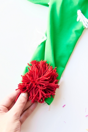 A green sleeve with a fake red flower