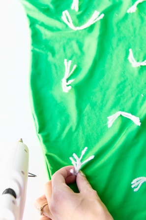 Green shirt with white strings in it