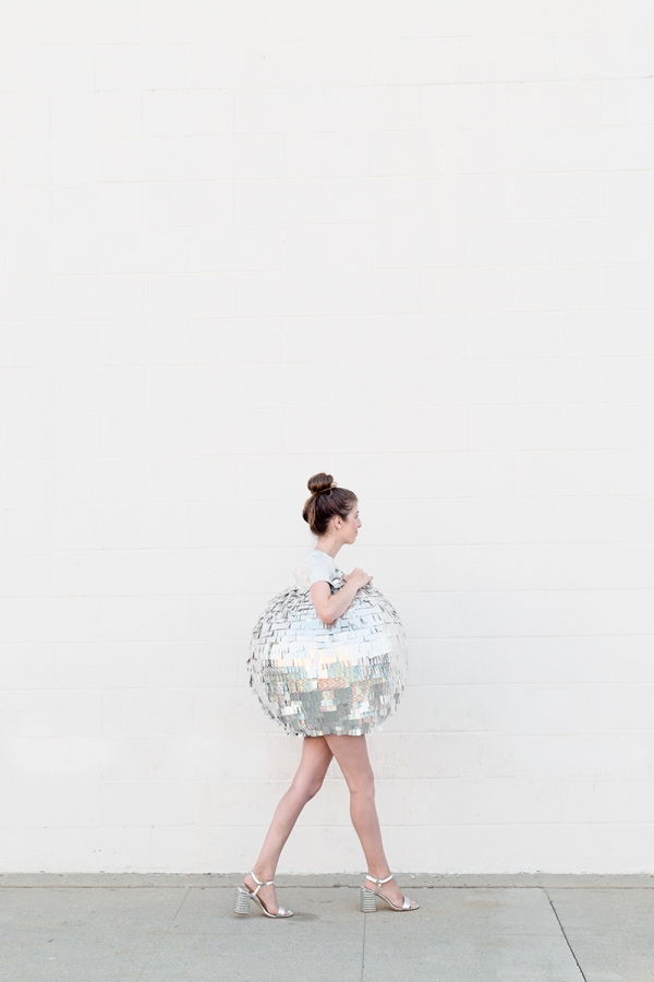 A woman dressed as a disco ball