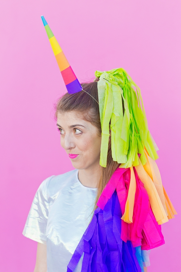 A woman dressed in a unicorn costume