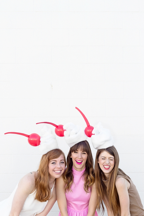 Three girls dressed in milkshake costumes
