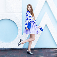 Three Bold + Colorful Looks for Fall A woman in a purple outfit