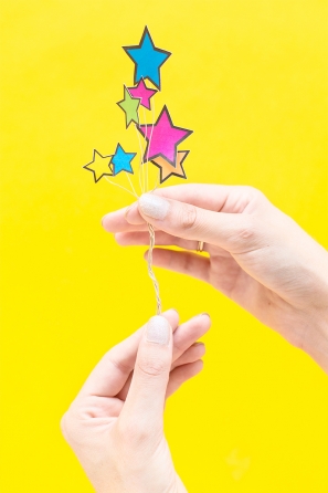 Someone holding paper stars 